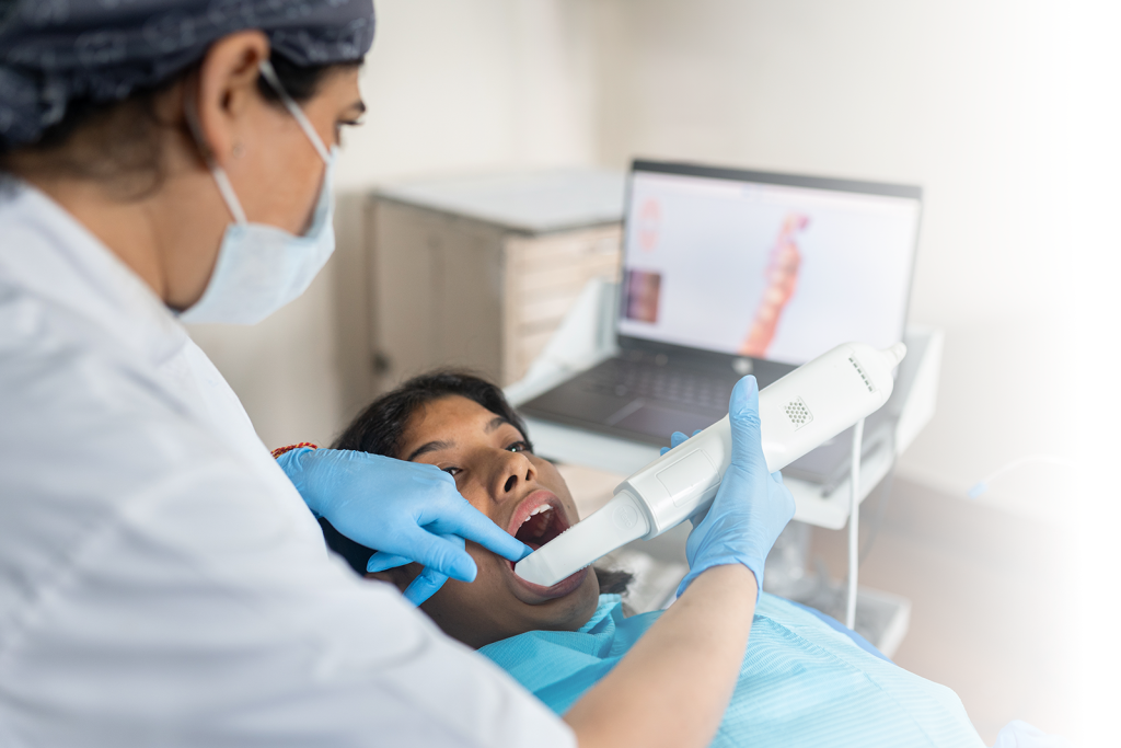 Dentist using an intraoral scanner